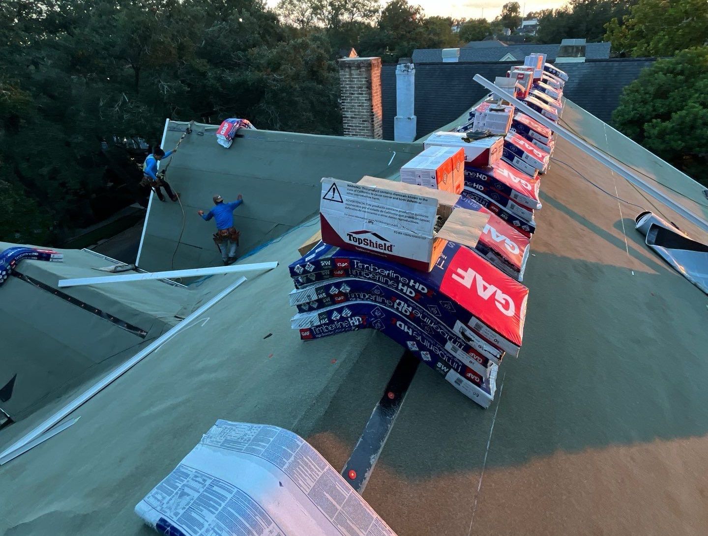 Roofer installing a commercial roof.