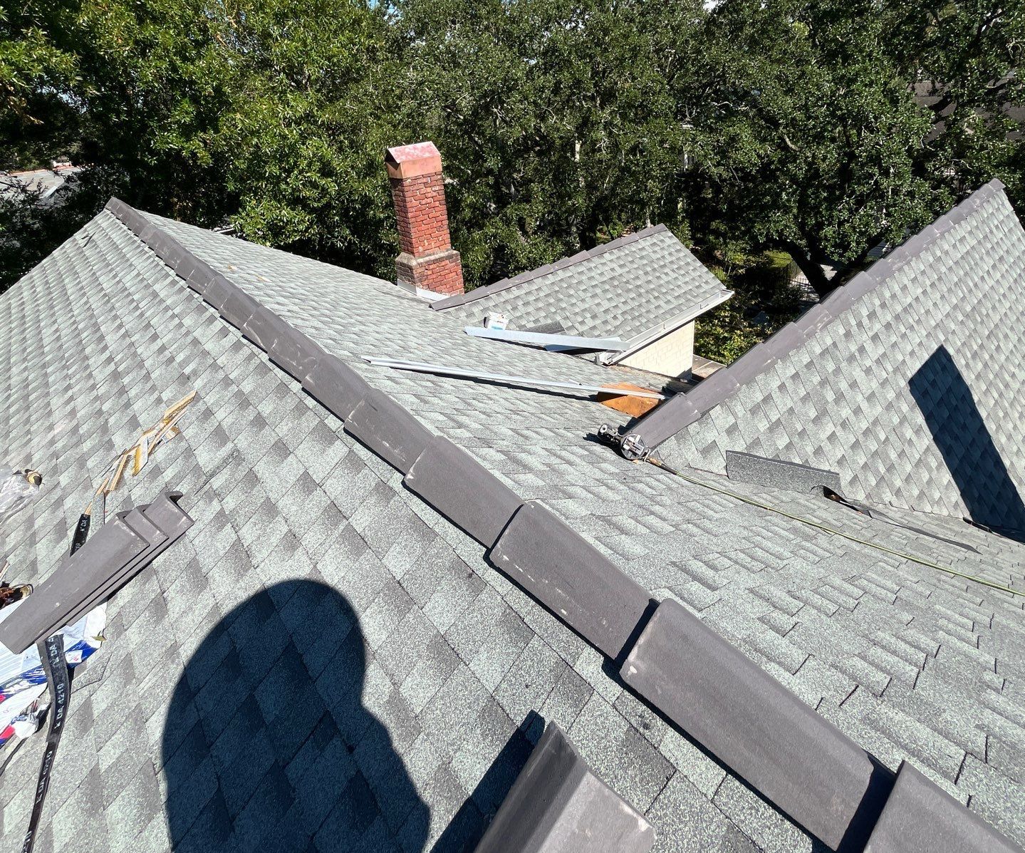 Roofer installing a residential roof in Travis County, TX.