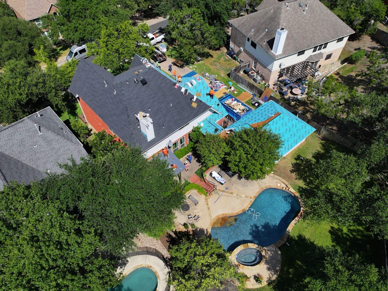 Roofer installing a residential roof in Williamson County, TX.