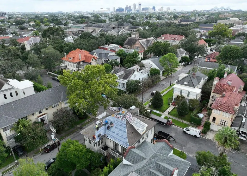 Roofer installing a residential roof.